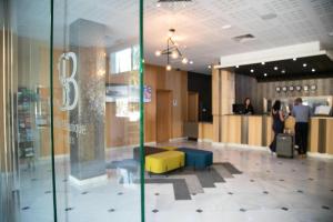 a lobby of a store with people in the background at Soho Boutique Las Vegas in Málaga +176 photos