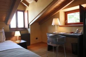 Posteľ alebo postele v izbe v ubytovaní Heritage Hotel Kukuriku