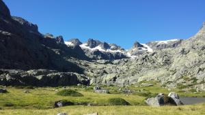 a view of a mountain range with sheep in a field at Loboratorio Rural, La Casa de al Lado in Casas del Abad +26 photos