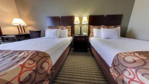 Ένα ή περισσότερα κρεβάτια σε δωμάτιο στο Econo Lodge +8 φωτογραφίες