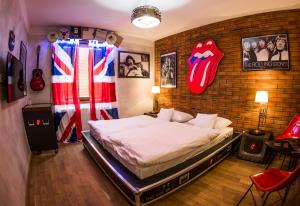 a bedroom with a bed with an american flag on the wall at Retro hotel Garage in Ostrava