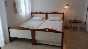 A bed or beds in a room at Nesaea Studio