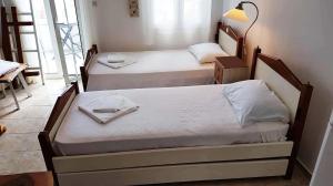 A bed or beds in a room at Nesaea Studio