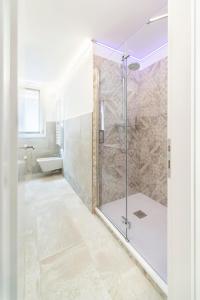 a bathroom with a shower stall and a tub at Ca' de la Fonte - WENICE Deep Culture in Venice