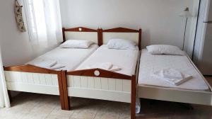 A bed or beds in a room at Nesaea Studio