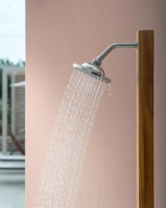 a shower head with water coming out of it at Anemolia Seaview Villa, with private Pool & Garden, By ThinkVilla in Gerani