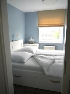 En eller flere senge i et værelse på Leuchtturmblick