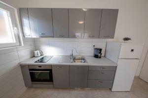 Kuchyň nebo kuchyňský kout v ubytování Apartmani Marica Beg