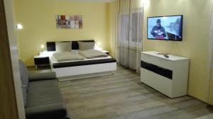 Postel nebo postele na pokoji v ubytování Hotel am Hindenburgplatz