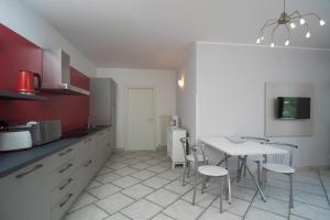 a kitchen with a table and chairs in it at Casa Carla in Nago-Torbole