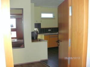 Kuchyň nebo kuchyňský kout v ubytování Hotel am Hindenburgplatz