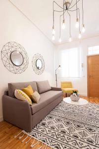 a living room with a couch and a rug at Malaga Center Flat Historic Center in Málaga