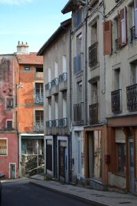 a group of buildings on the side of a street at File dans ta chambre ! in Le Monastier sur Gazeille