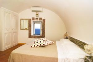 Кровать или кровати в номере Bella Baia Relais