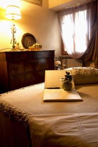 Łóżko lub łóżka w pokoju w obiekcie Holiday home Porta alla Fonte