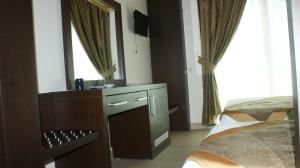 טלויזיה ו/או מרכז בידור ב-Palmira Hotel