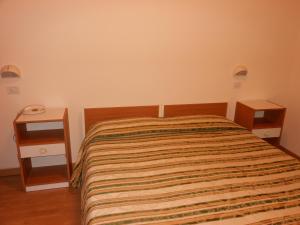 Postel nebo postele na pokoji v ubytování Hotel Cecco