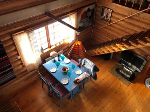 an overhead view of a dining room table in a cabin at Rabens Cottage in Bengtsfors