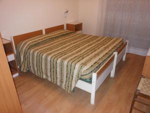 Postel nebo postele na pokoji v ubytování Hotel Cecco