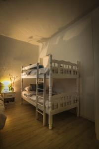 a bedroom with two bunk beds in a room at Apartment Nijona in Trebinje