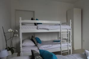 a room with two bunk beds with pillows at Apartment Nijona in Trebinje