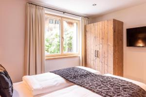 Posteľ alebo postele v izbe v ubytovaní Fetz Luxury Appartements