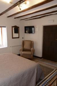 TV a/nebo společenská místnost v ubytování Casa Rural Aromas de la Manchuela