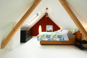 מיטה או מיטות בחדר ב-Ferienhaus Atelier