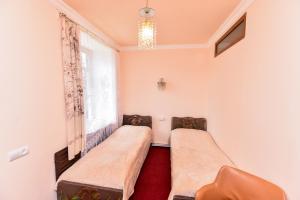 a room with two beds and a window at Holiday Home Ruben in Odzun