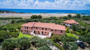 an aerial view of a house with the ocean at Mirtia Studios in Minia