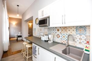 Η κουζίνα ή μικρή κουζίνα στο D8 Design Apartment & Studio