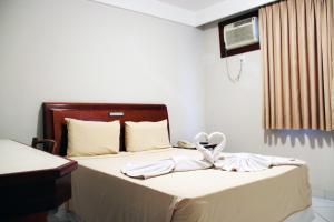 Letto o letti in una camera di Hotel Minuano