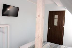 Telewizja i/lub zestaw kina domowego w obiekcie Willa Idylla