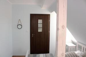 Łóżko lub łóżka w pokoju w obiekcie Willa Idylla