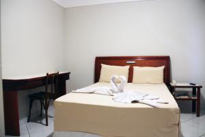 Letto o letti in una camera di Hotel Minuano