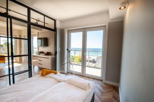 Łóżko lub łóżka w pokoju w obiekcie Al Mare - Apartamenty i pokoje