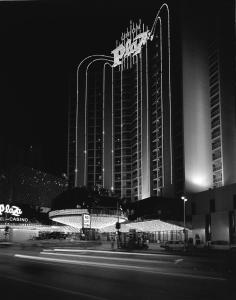 a hotel with a sign in front of it at night at Plaza Hotel & Casino in Las Vegas