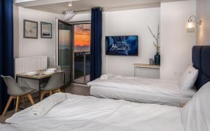 Łóżko lub łóżka w pokoju w obiekcie Al Mare - Apartamenty i pokoje