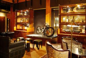 a restaurant with a motorcycle on a table and chairs at The Iron Horse Hotel in Milwaukee