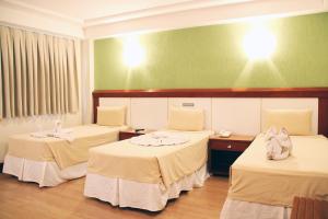 Letto o letti in una camera di Hotel Minuano