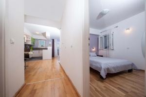 Posteľ alebo postele v izbe v ubytovaní Apartment Sarena