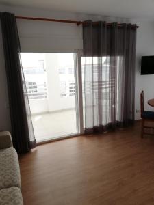 Televízia a/alebo spoločenská miestnosť v ubytovaní Live Salou Apartment