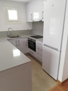 Kuchyňa alebo kuchynka v ubytovaní Live Salou Apartment