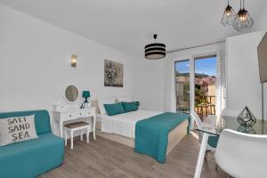 a bedroom with a bed and a table and a desk at Apartment Kate in Podgora