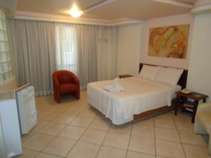 Letto o letti in una camera di Hotel Minuano