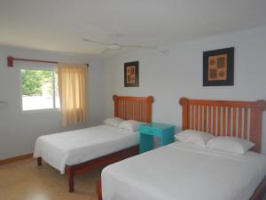 Cama ou camas em um quarto em Blue Coconut Cancun Hotel