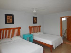 Cama ou camas em um quarto em Blue Coconut Cancun Hotel