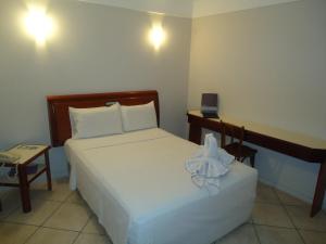 Letto o letti in una camera di Hotel Minuano