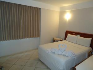 Letto o letti in una camera di Hotel Minuano