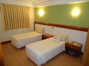 Letto o letti in una camera di Hotel Minuano